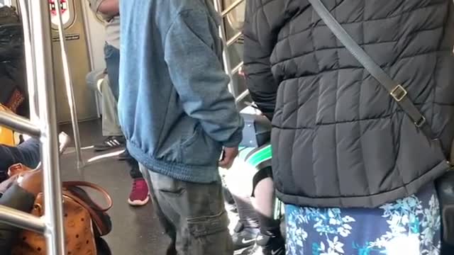Two men rap on subway station
