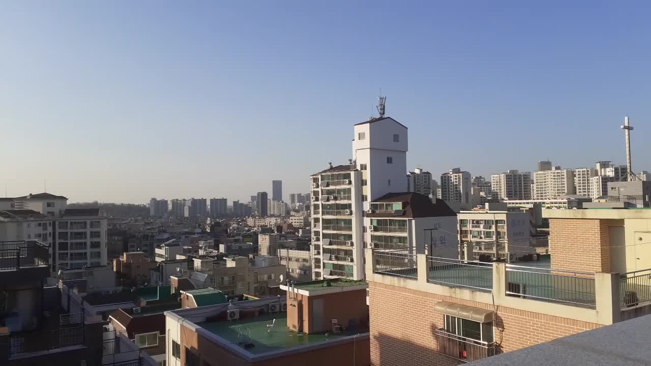 Sky and sunlight and buildings from the rooftop