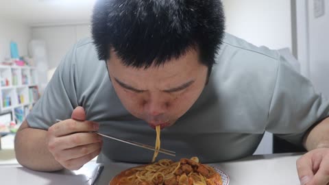 Man enjoys spaghetti