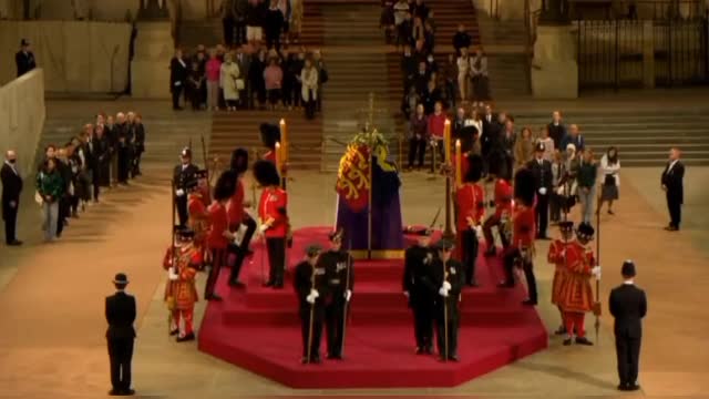 Royal guard at the Queen's coffin has collapsed.