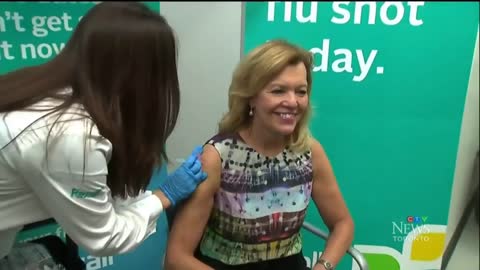 Canadian Health Minister takes a FAKE flu jab [NO NEEDLE]