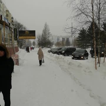 Snowy panorama of the city in a blizzard.