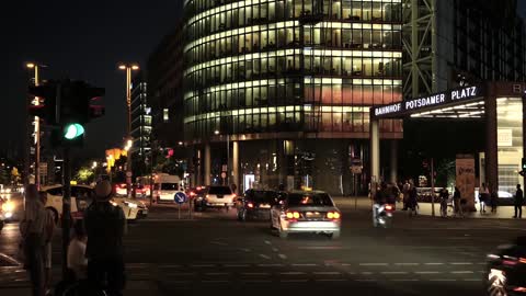 Night scene of the street with people coming home from get off work