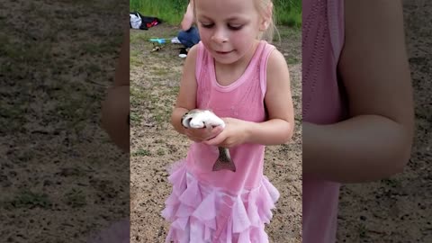 girl kiss fish for the first time