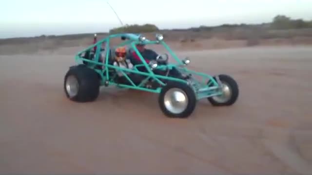 Sandfill and copilot doing wheelies in the SandSquatch Sand Rail