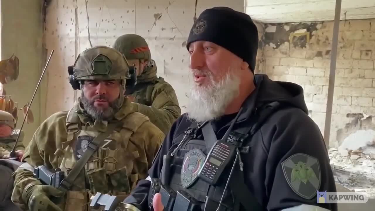 Chechen commander leading his fighters at front with an AK in his hands at Mariopul