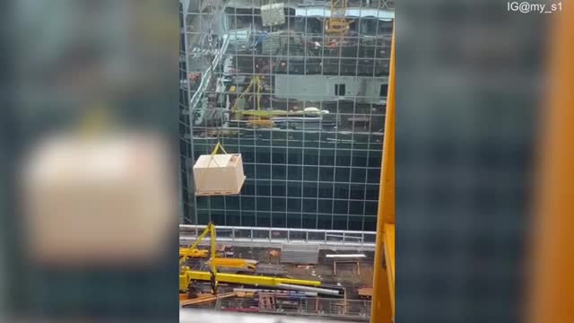 Terrifying moment Canadian construction worker clings on to tagline