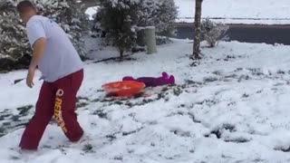 Dad snow daughter pulling fail