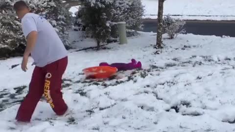 Dad snow daughter pulling fail