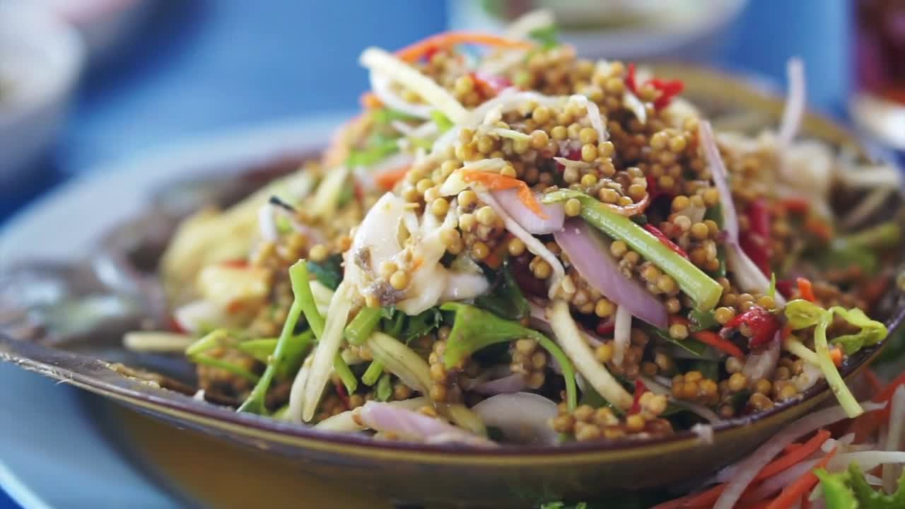 Thai cuisine seafood dish, mango papaya spicy salad with Horseshoe Crab (Limulidae) eggs