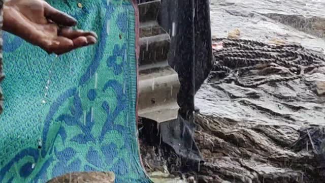 Child bathing in rain. Child enjoying in rain. Indian Village life. Village life of india.