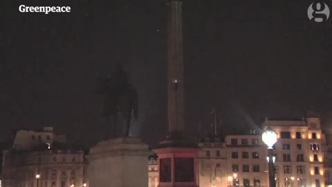 Greenpeace protesters climb Nelson's Column