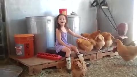 so cute ella rose is playing with her chickens