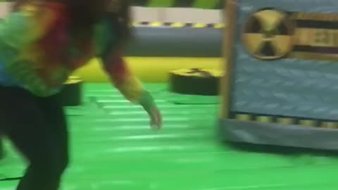 Girl tye dye shirt fails to jump over pole trampoline park