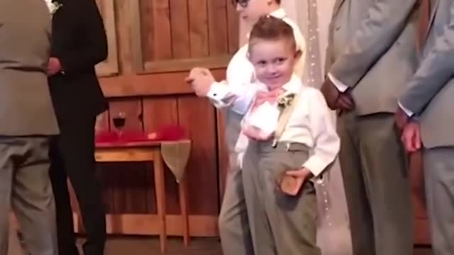 Kid adds some comedy to the wedding!