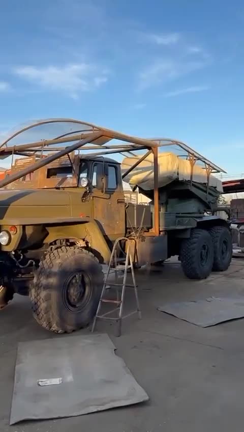 Modification of BM-21 Grad MLRS with protective screens and extra armour plates due to drone attacks