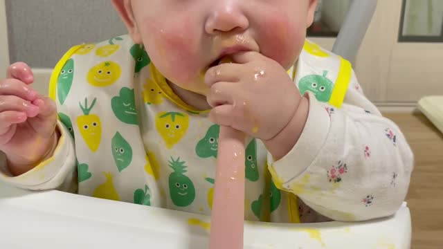 The little child is eating a delicious meal.