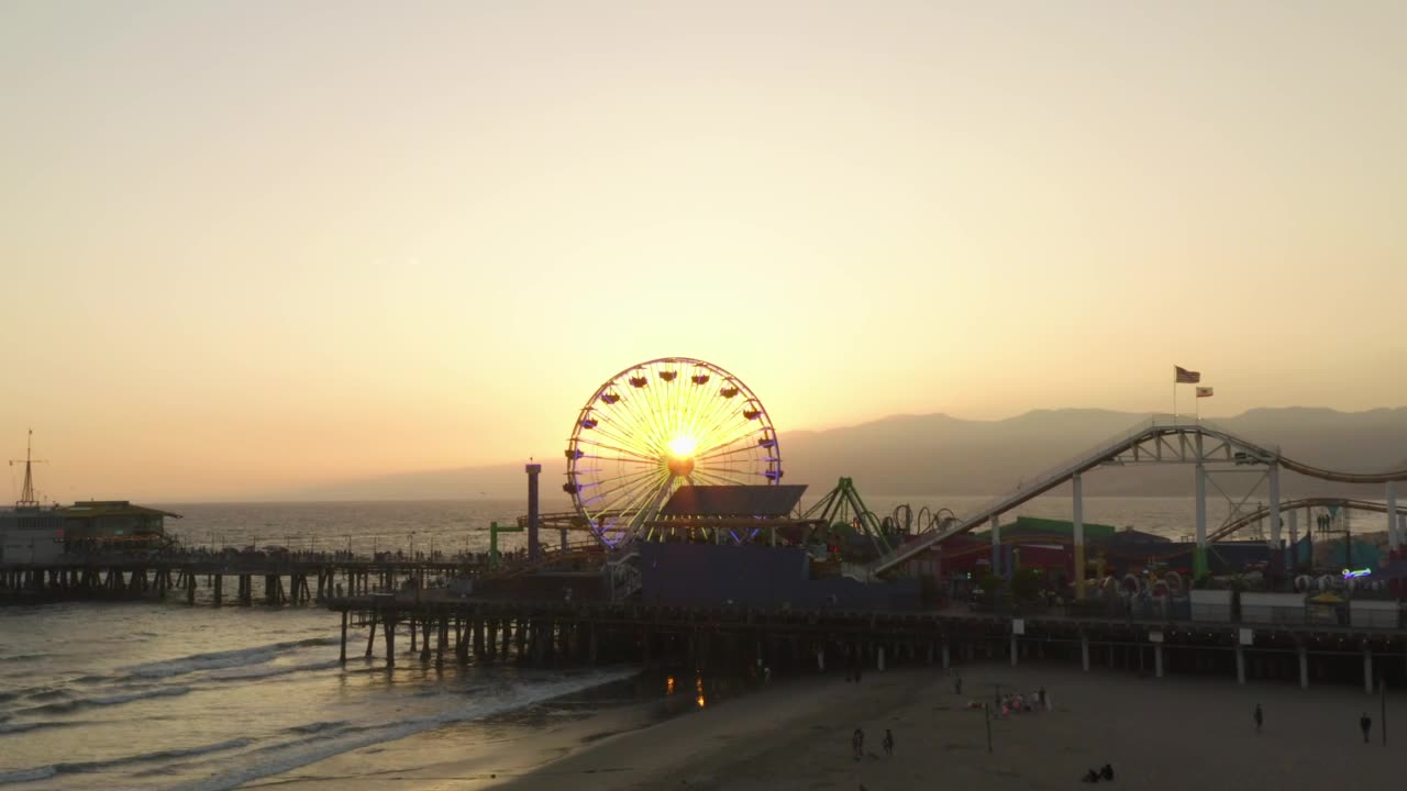 Amusement park by the sea at sunset