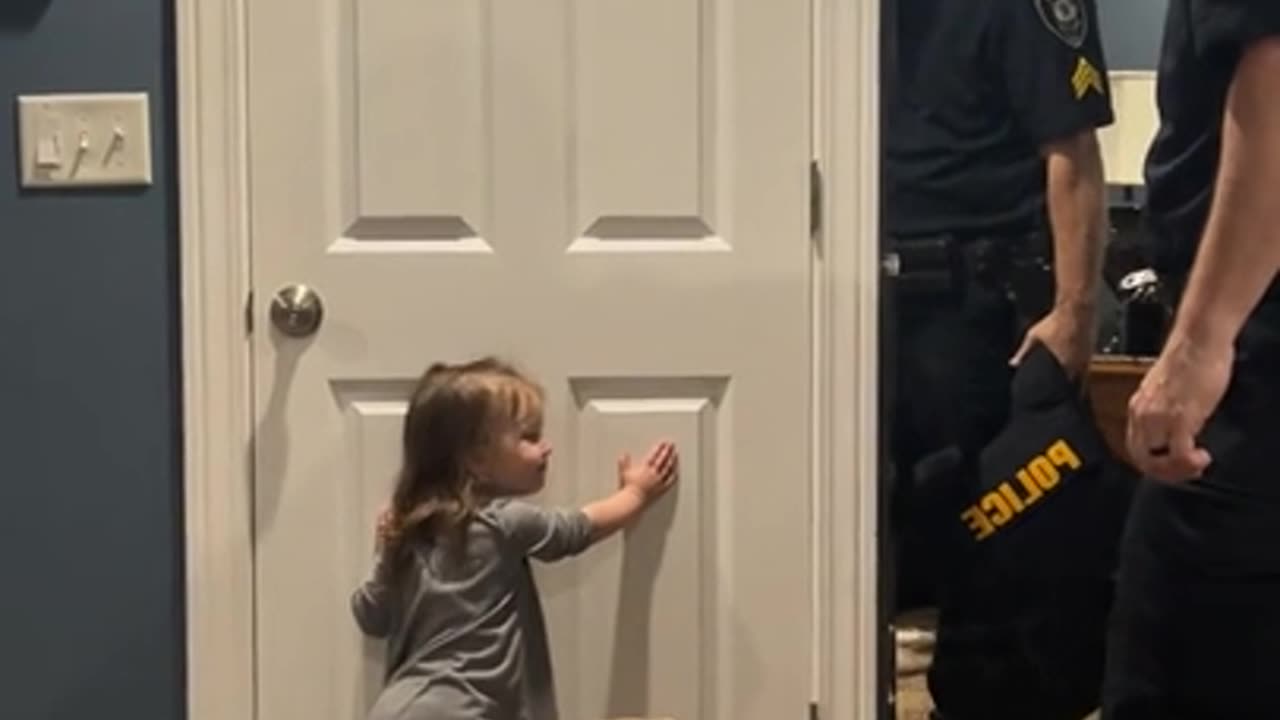 Little girl loves her dad, but she has more important