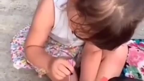 Little girl playing with chicken