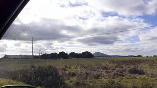 Driving a car through nature passenger seat view