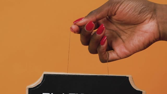 Person Holding a CardBoard with a Message