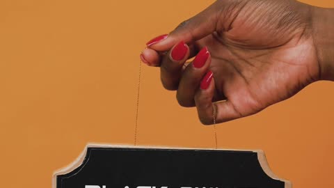 Person Holding a CardBoard with a Message