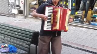 Accordionist playing an old Uruguayan folk song, Ciudad Vieja, Montevideo