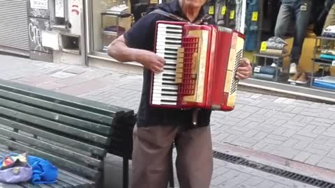 Accordionist playing an old Uruguayan folk song, Ciudad Vieja, Montevideo