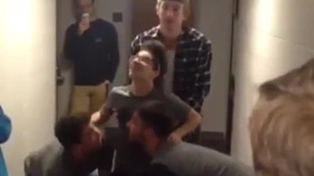 Couple of guys launch their friend into the roof of their dorm hall