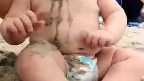 funny baby reaction on the beach