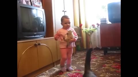 Mama cat snatches crying kitten from toddler