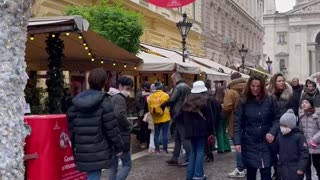 French bulldog goes sightseeing in Budapest with Santa on his back