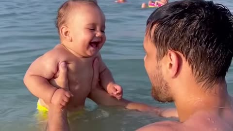 Beachgoing Baby Belly Laughing