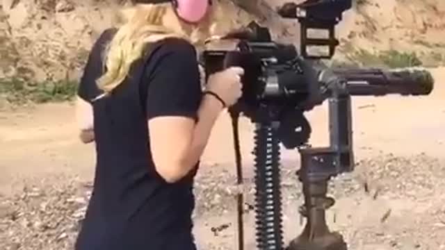 Girl and machine guns are lovely to be watch