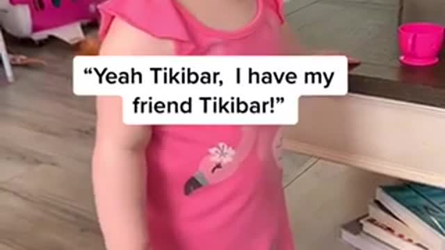Toddler having a conversation with her mum