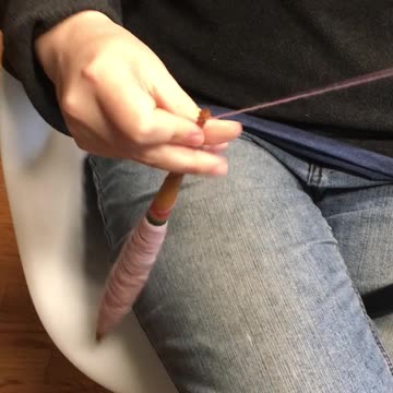 Spinning With a Bulgarian spindle and Distaff