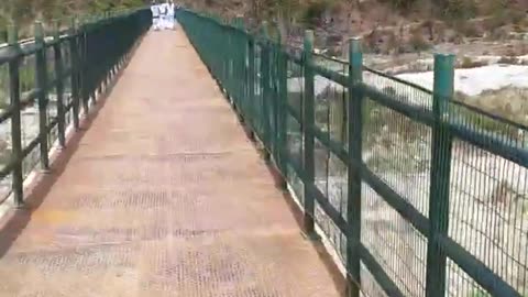 River bridge in mid of mountains