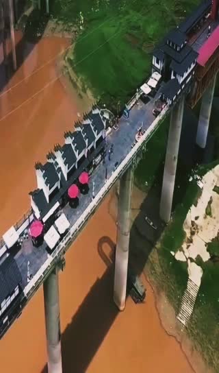 MOST AMAZING BRIDGE WITH HOUSES.