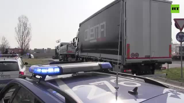 Large truck convoy rolls through Brescia, Italy to protest against high petrol prices