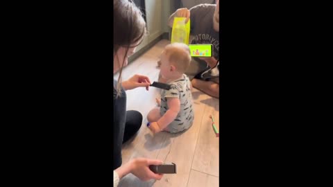 Not an easy task to Cut an infants hair.