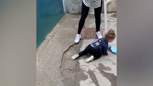 Funny kids scaring from big huge fish