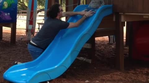 Collab copyright protection - pony tail dad saves toddler on slide