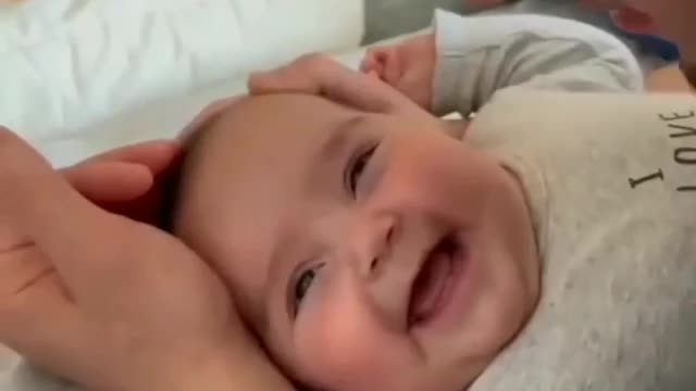 Baby gets lots of kisses from his daddy for her cuteness