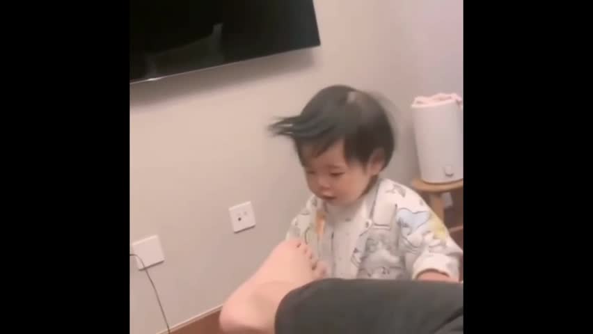 funny baby smells toe