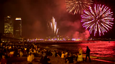 People seeing fireworks in the beach