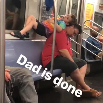 Kid boy tie dye shirt on dads back standing on dads back