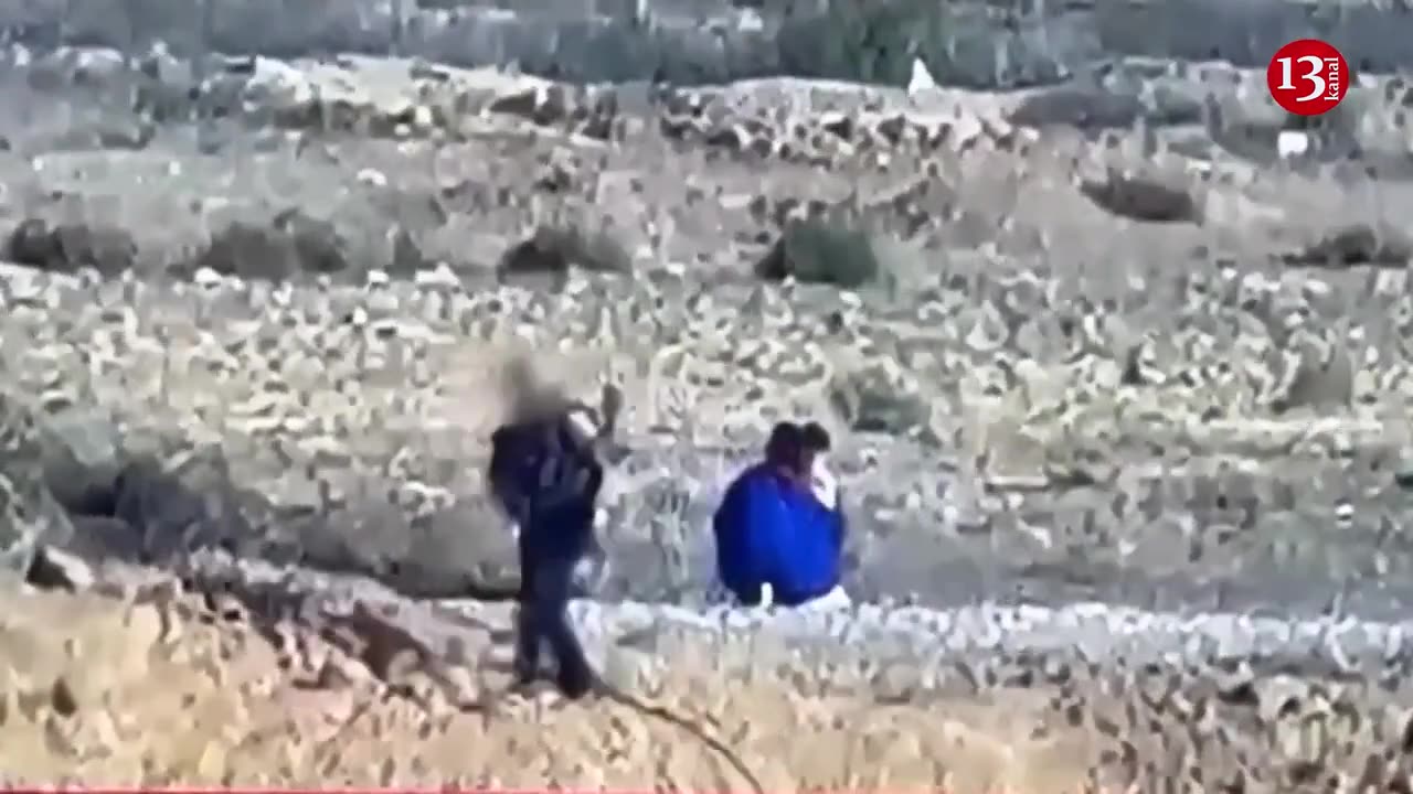 An image of the release of an Israeli woman and her two children captured by Hamas fighters