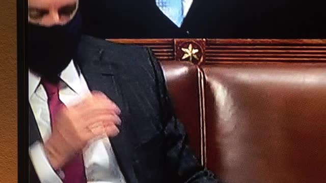 Democrat removes mask to sneeze in his hand