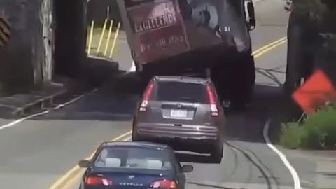 Truck carriage load passby the edge of bridge slams the entire load video